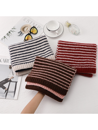 Beige, red and brown striped scarves displayed together