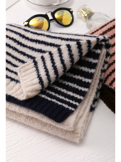 Close-up of the striped knit pattern and ribbed scarf ends