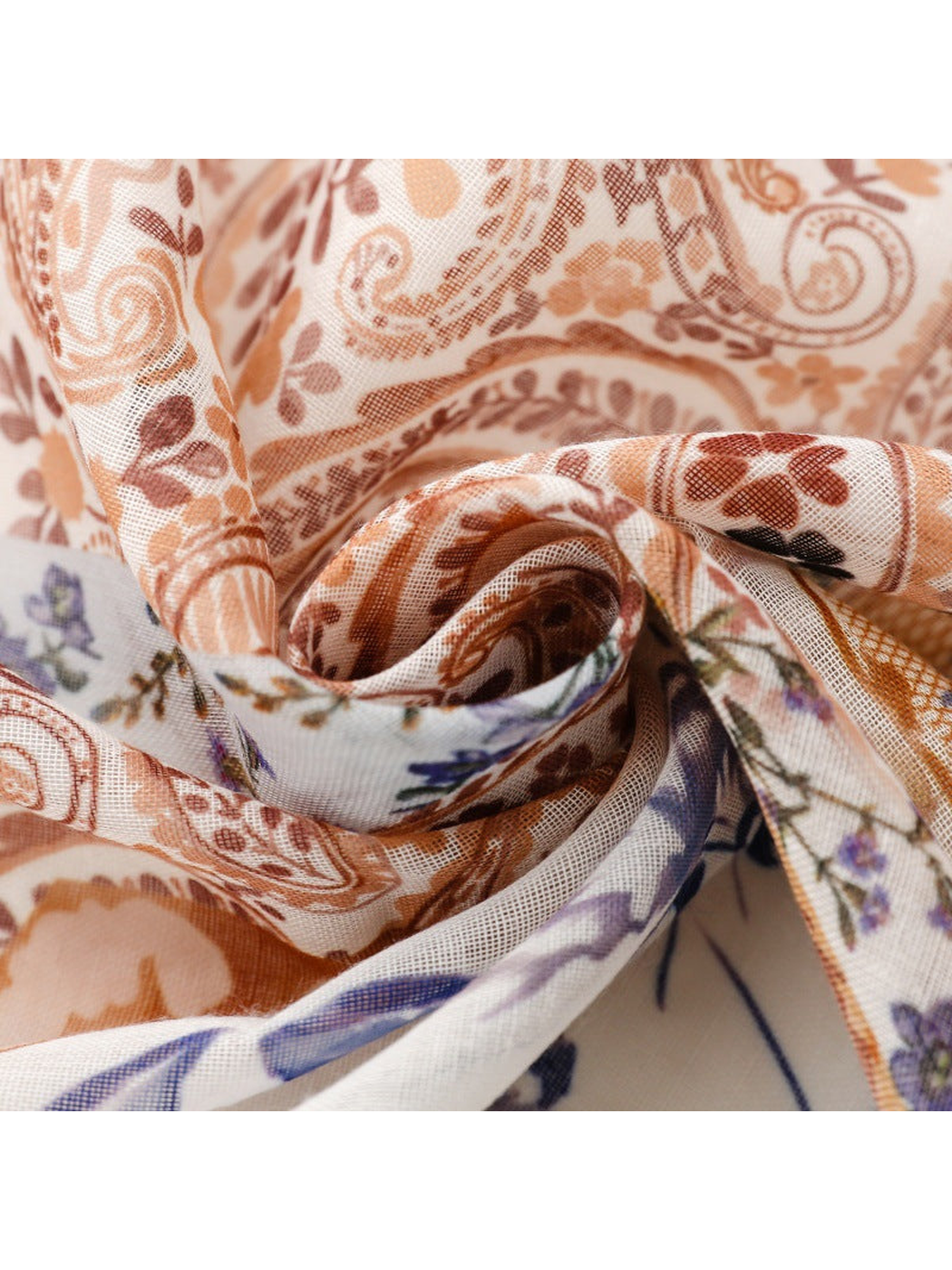 Close-up of the scarf's semi-sheer texture and paisley print