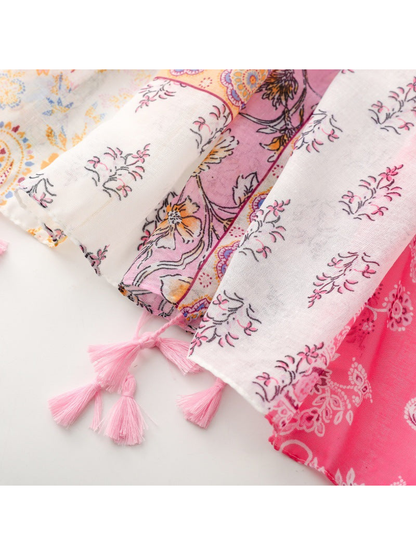 Close-up of the scarf edges with small pink tassels
