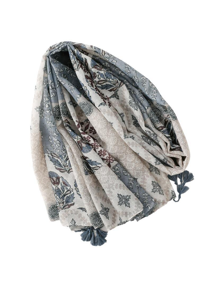 Blue-gray and ivory patterned scarf with tassels, loosely draped view