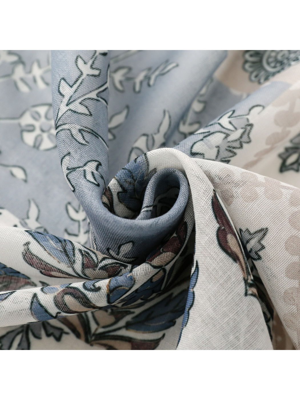 Close-up of the scarf's fine semi-sheer weave and blue-gray floral pattern