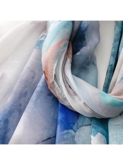 Close-up of the scarf's narrow stitched edge and layered abstract pattern