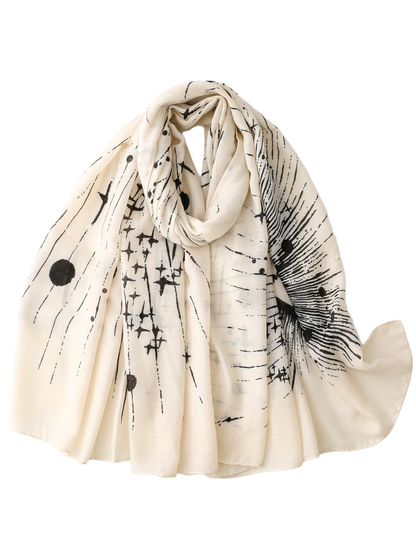 Ivory scarf with black abstract celestial print, draped view