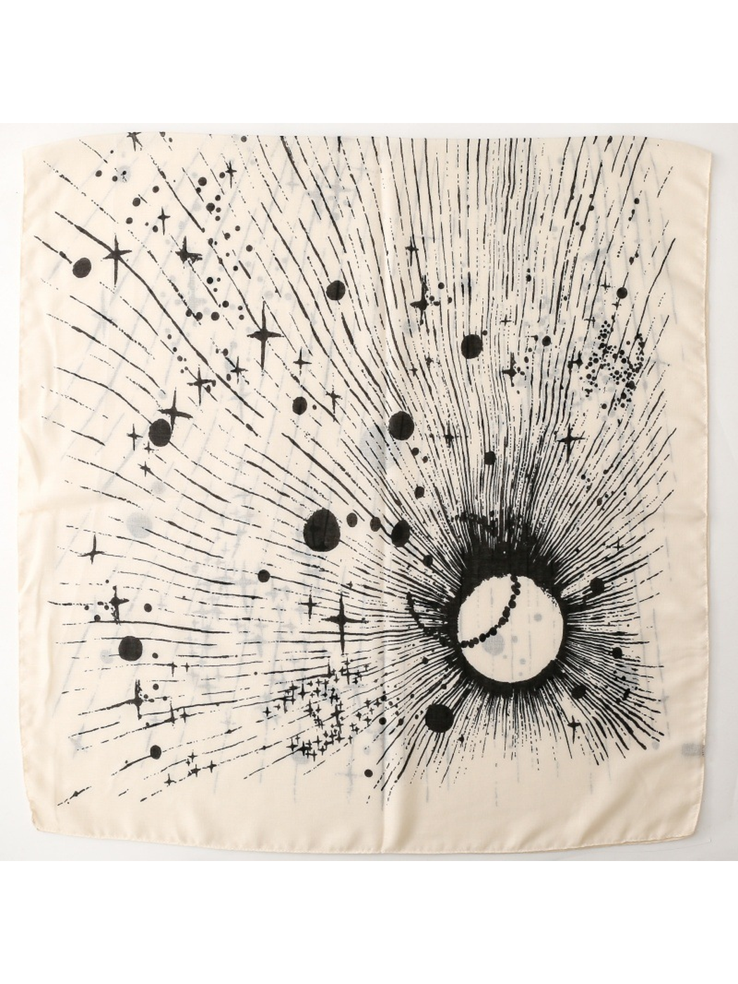 Ivory scarf laid flat with a black radiating celestial motif