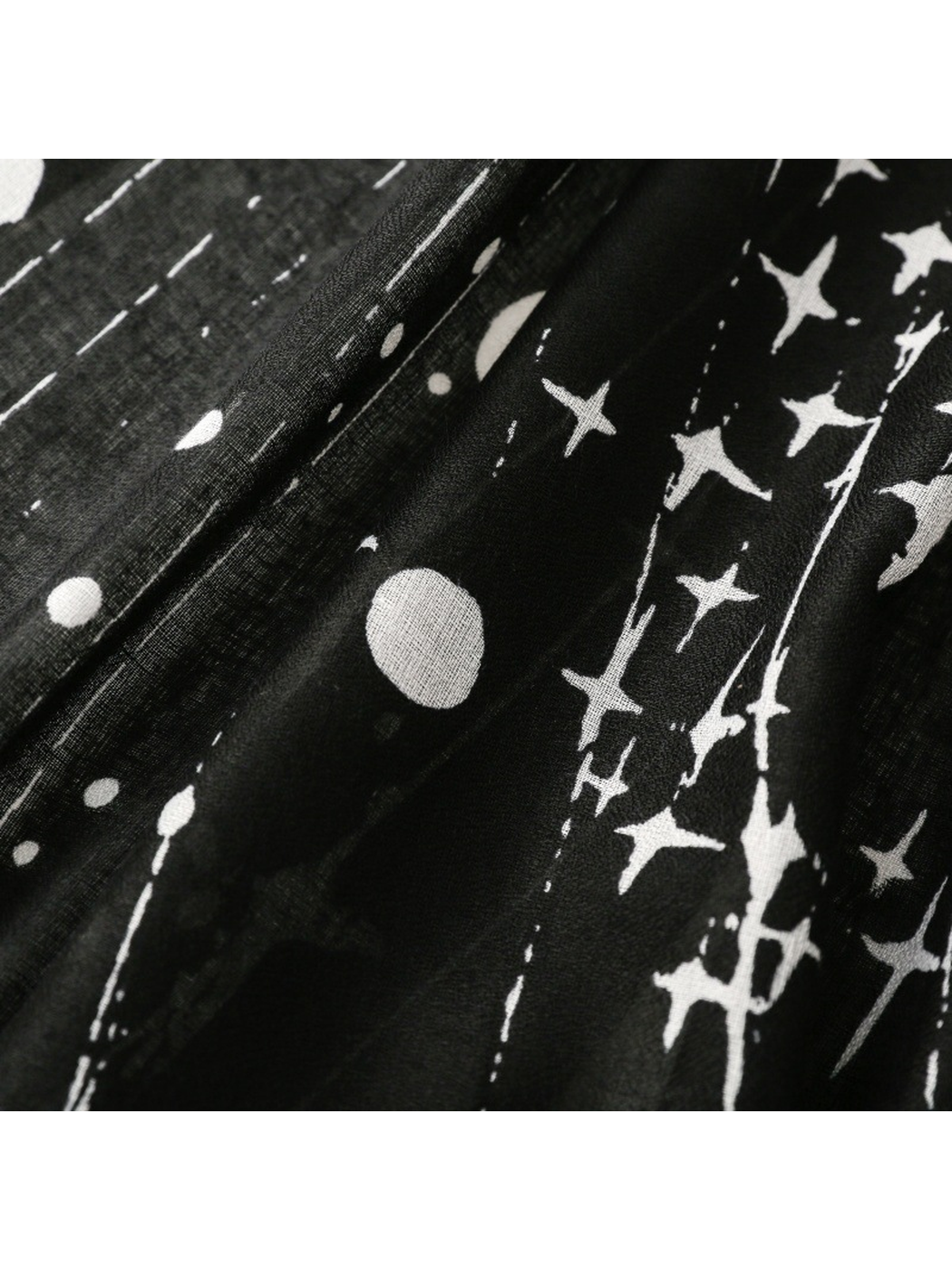 Close-up of the Black scarf's white stars, dots, and linear print