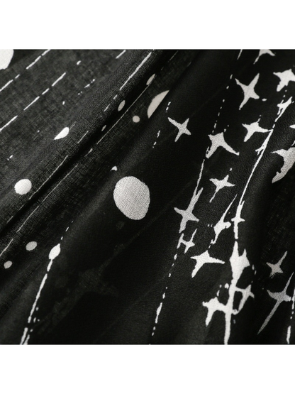 Close-up of the Black scarf's white stars, dots, and linear print