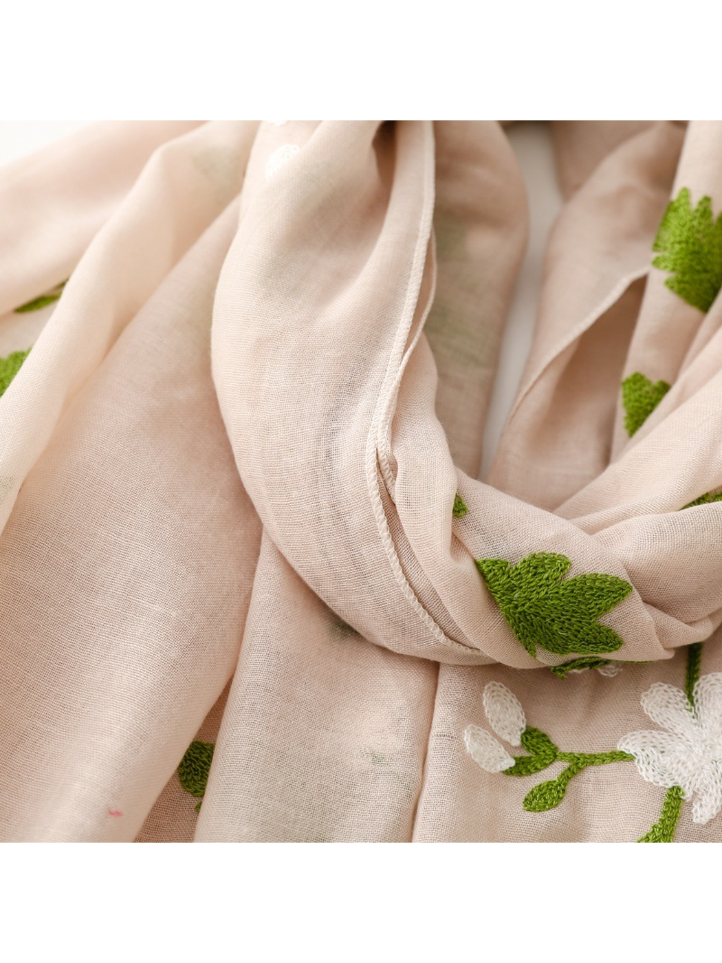 Close-up of the Beige scarf's stitched edge and semi-sheer weave