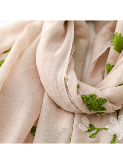Close-up of the Beige scarf's stitched edge and semi-sheer weave