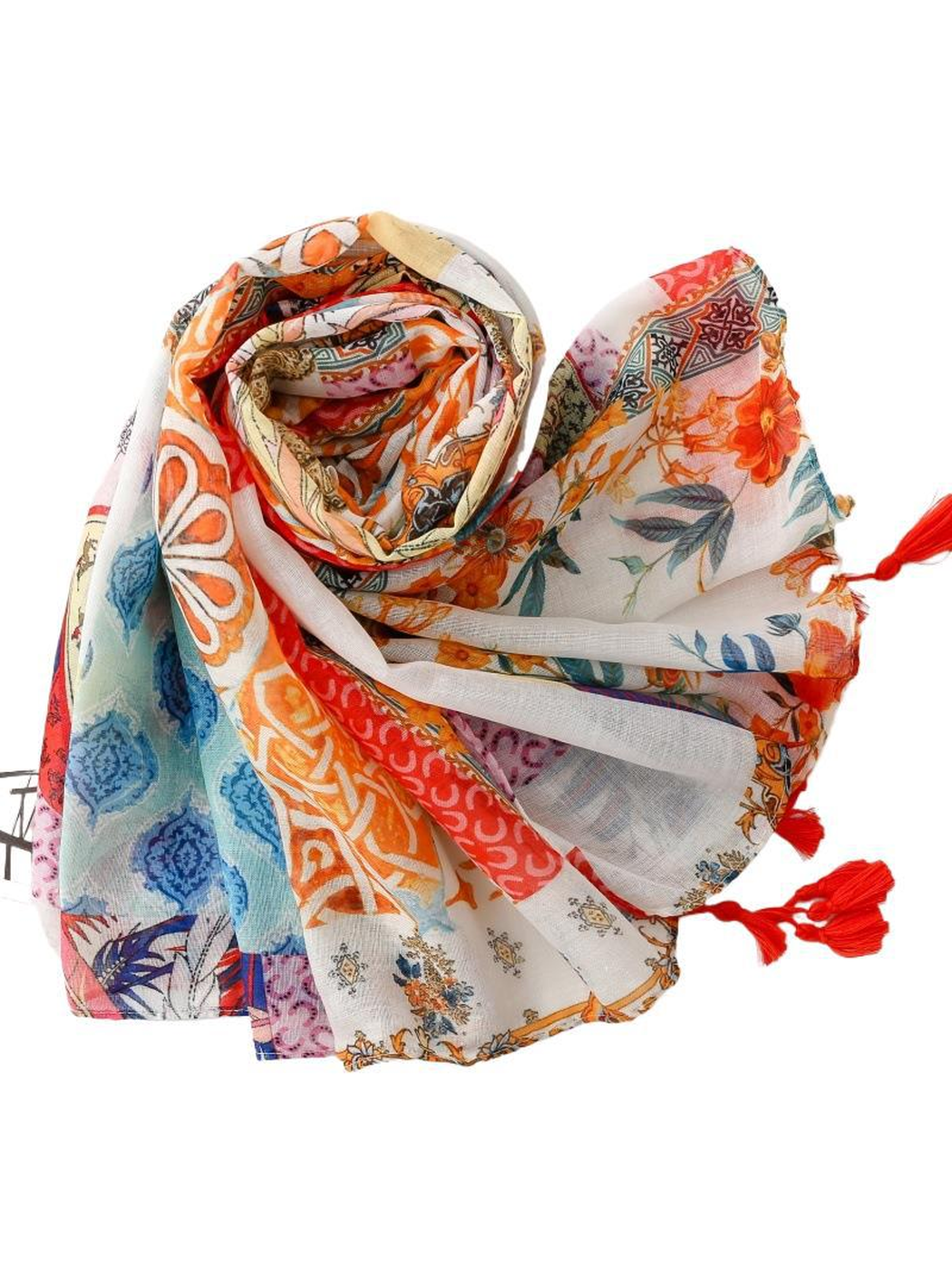 Multicolor patchwork scarf loosely rolled with patterned ends and red tassels