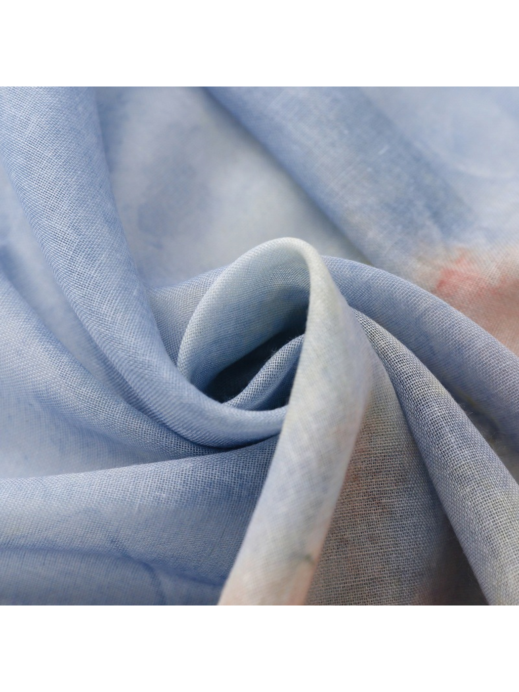 Close-up of the fine semi-sheer weave in pale blue