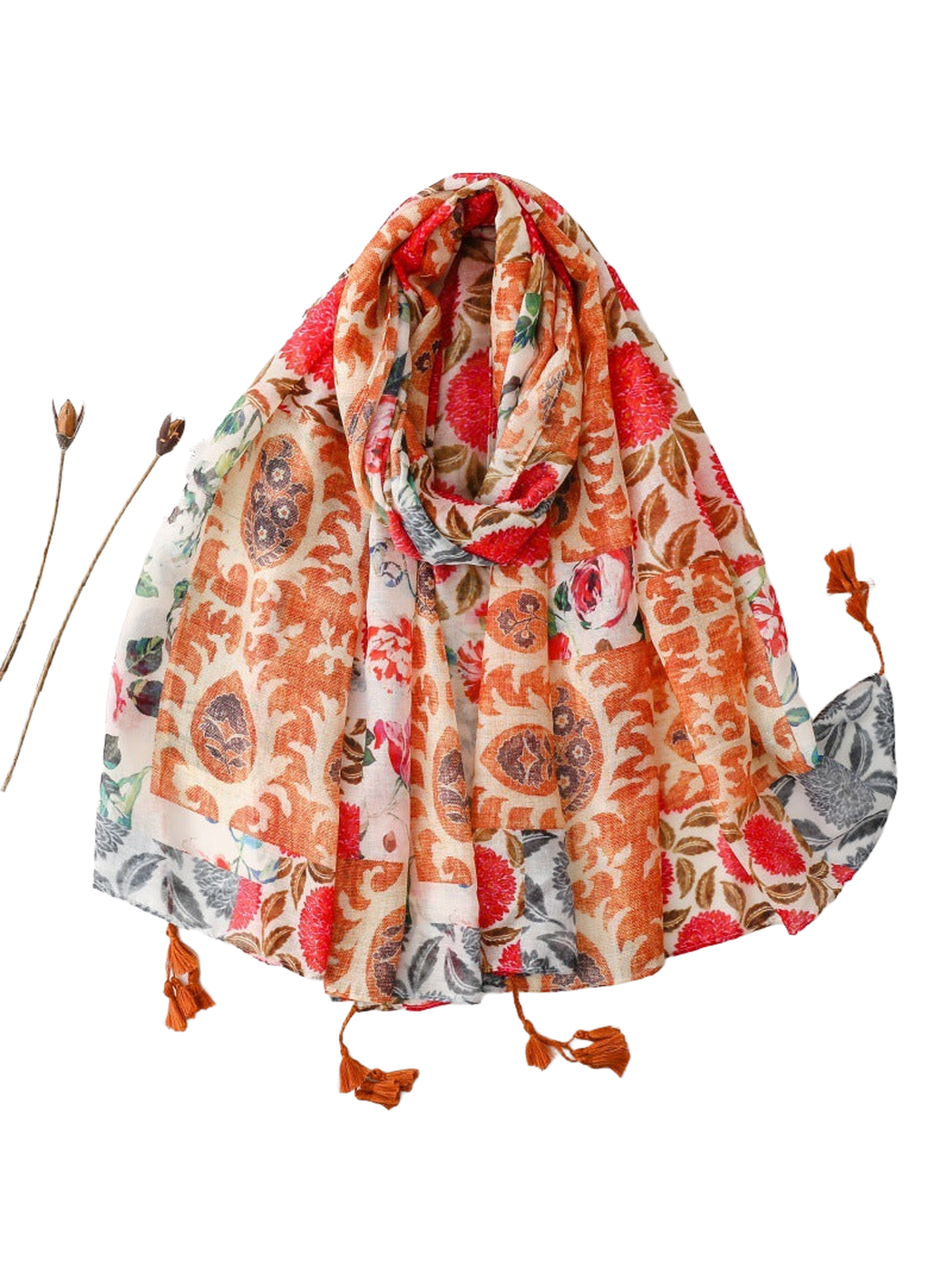 Multicolor patchwork floral and paisley scarf with rust-orange tassels, draped view