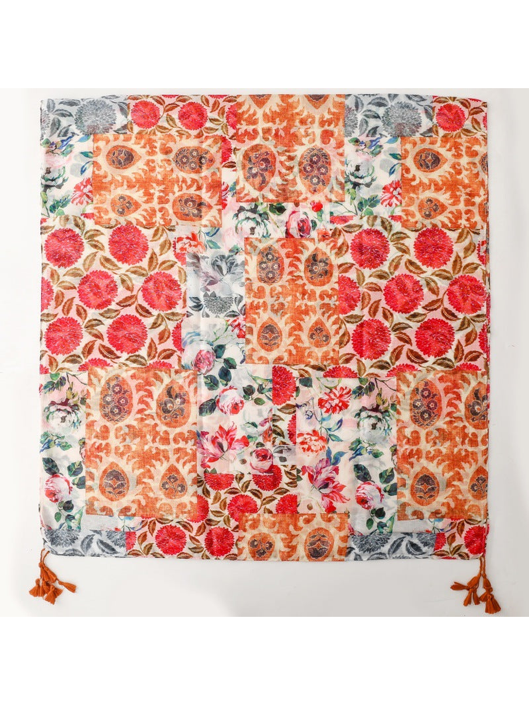Multicolor rectangular scarf spread flat to show the patchwork floral and paisley pattern
