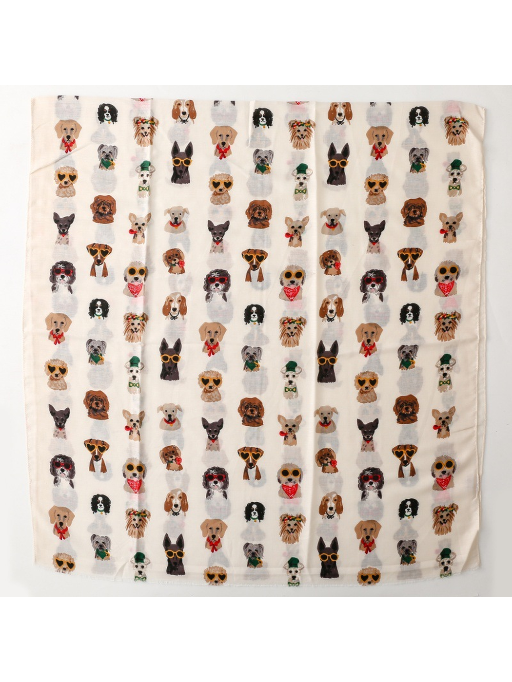 Ivory rectangular scarf laid flat to show the repeating dog portrait print