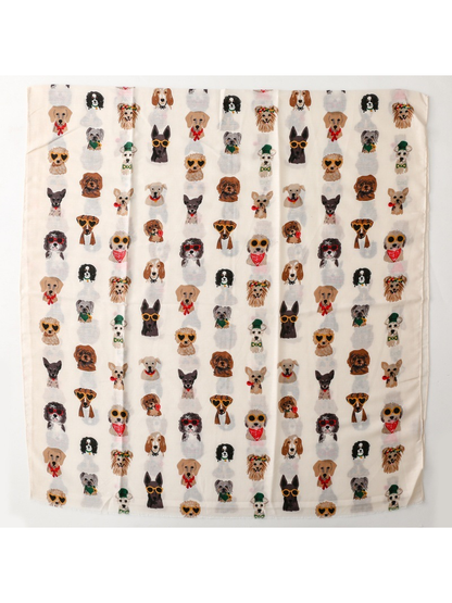 Ivory rectangular scarf laid flat to show the repeating dog portrait print