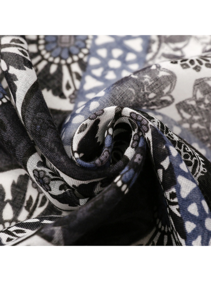 Close-up of the scarf's fine weave and overlapping patchwork motifs