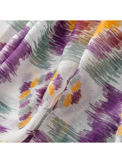 Close-up of purple, gray-green and mustard brushstroke motifs on the scarf