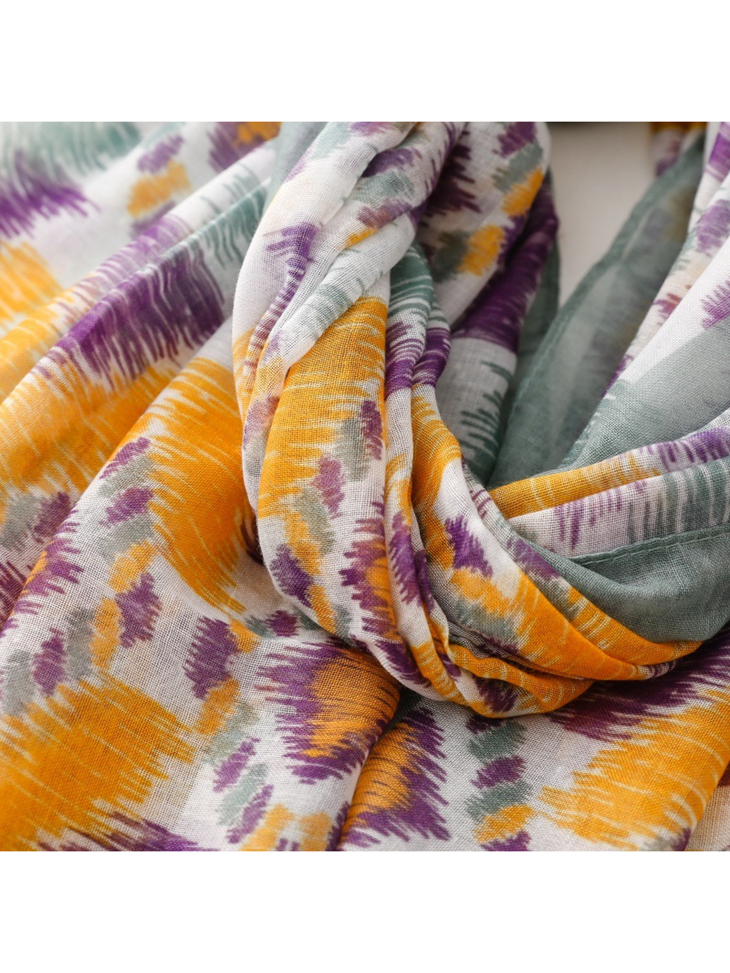 Close-up of the multicolor scarf gathered into soft folds