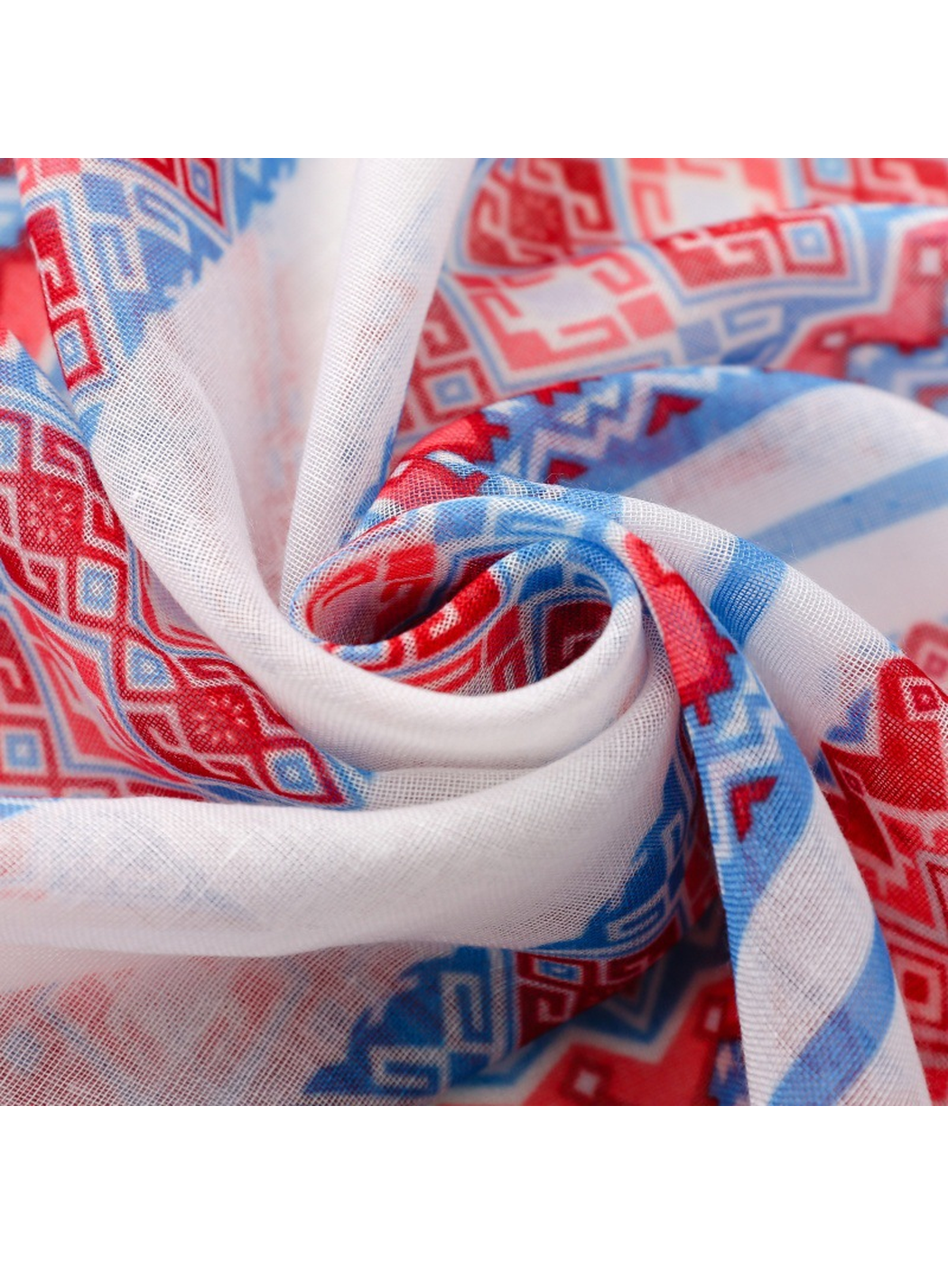Close-up of the semi-sheer weave and red and blue geometric print