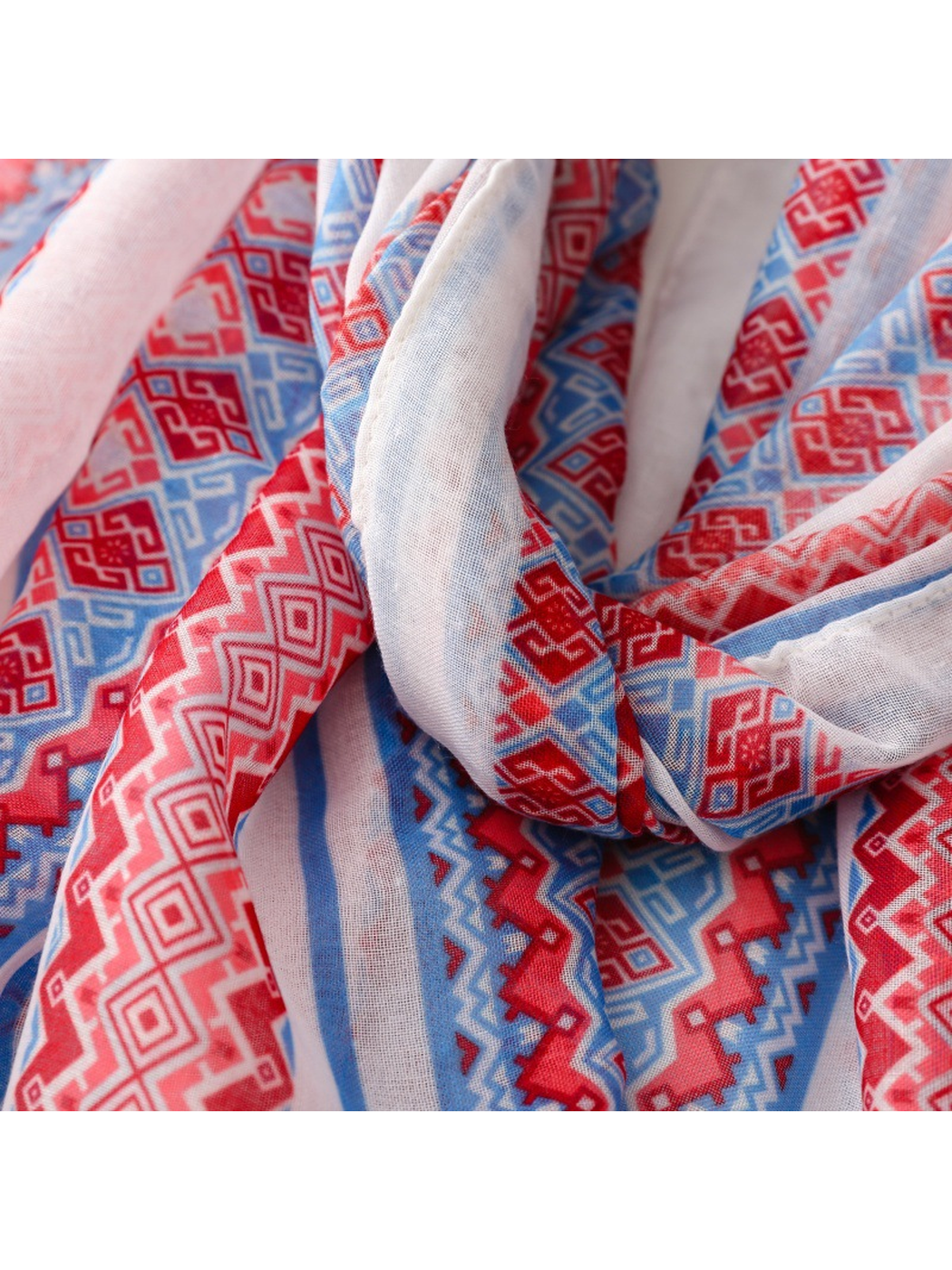 Close-up of the red and blue geometric print across gathered folds