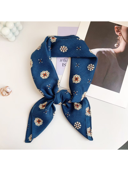 Teal Blue medallion-pattern square scarf tied in a loop