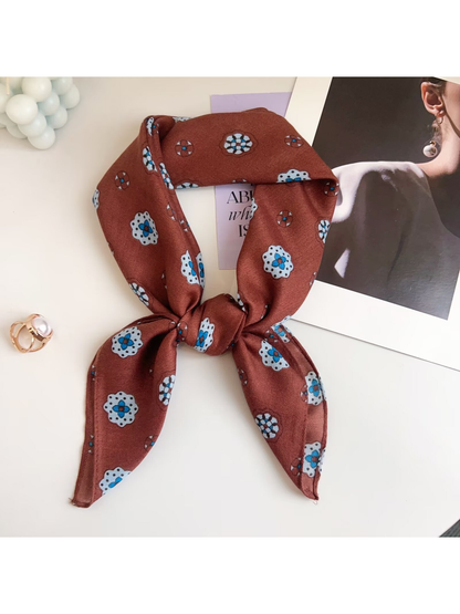 Orange Red medallion-pattern square scarf tied in a loop