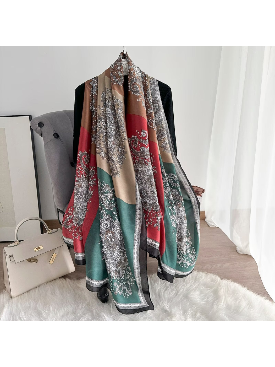 Brown, red and green color-block paisley scarf draped at full length