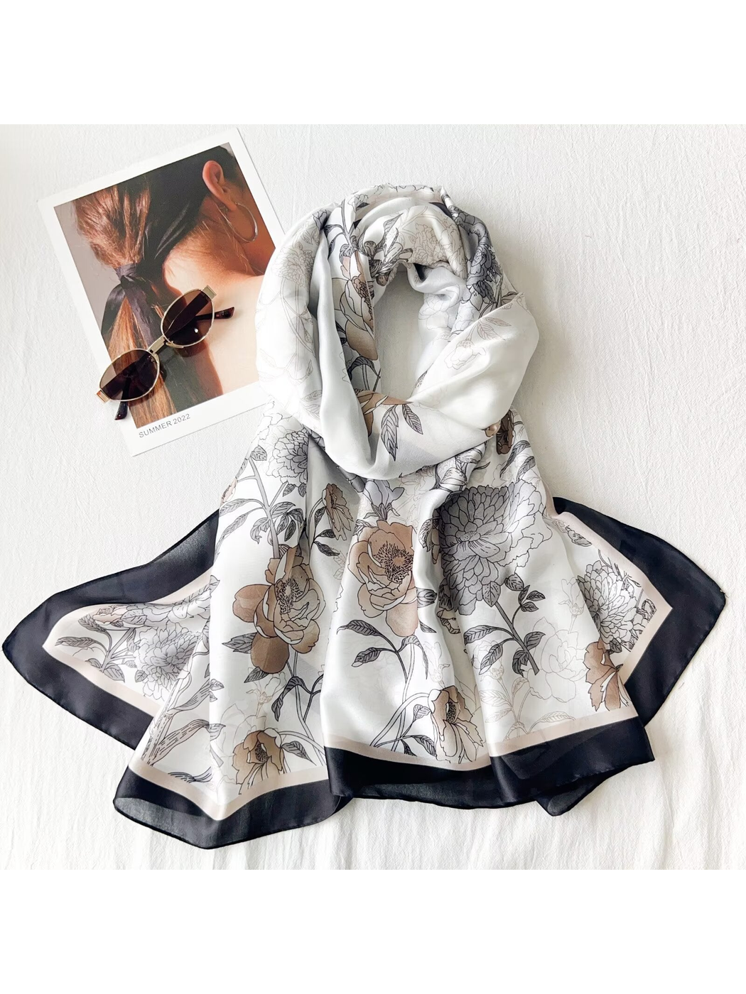Black Gray floral scarf arranged in a dimensional drape with sunglasses