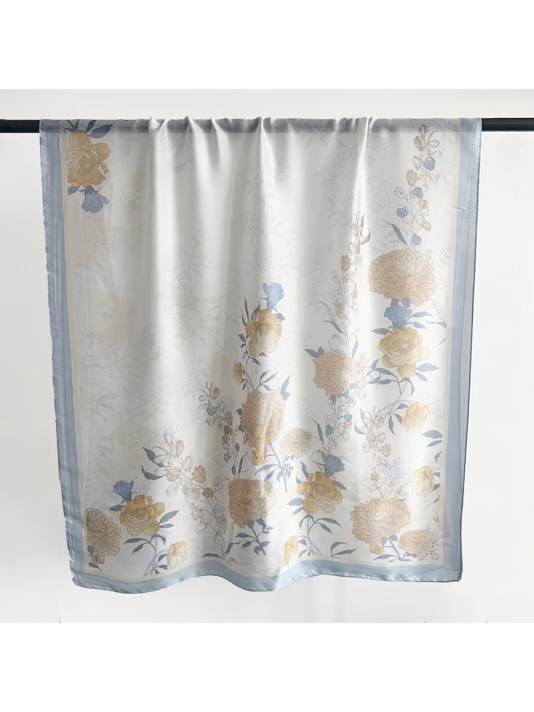 Light Blue floral scarf in a full hanging view showing the border and botanical pattern