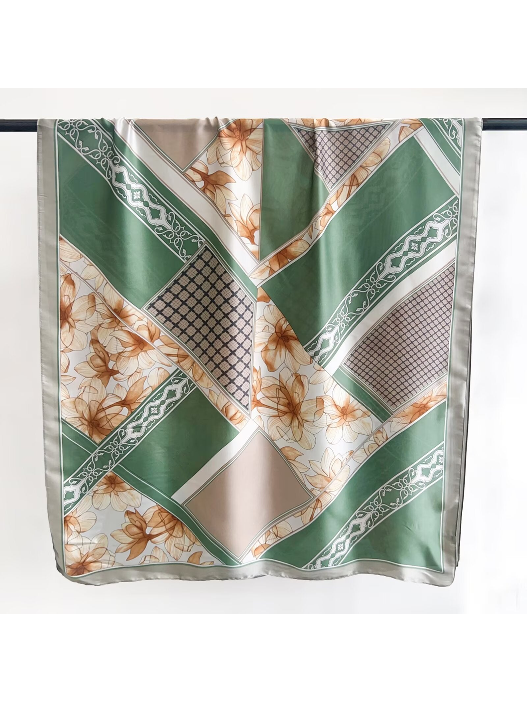 Green, cream and tan long rectangular scarf with floral and geometric patchwork print