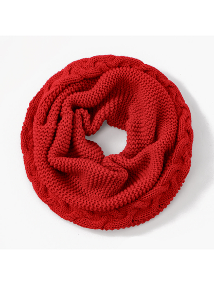 Red knit infinity scarf arranged in a loop, top view