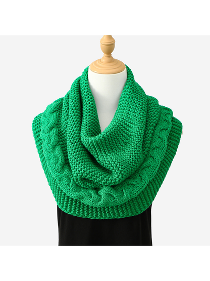 Green knit infinity scarf with braided cable border, draped front view