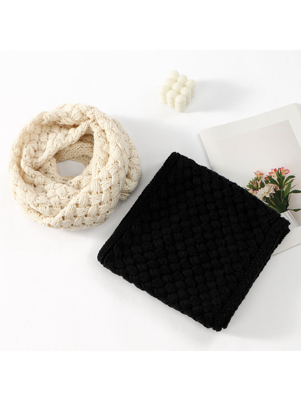 Cream and black basket-pattern infinity scarves displayed together