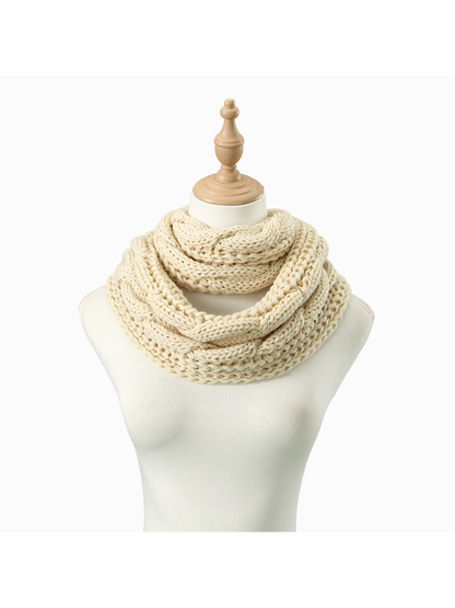 Cream Cable infinity scarf looped on a dress form