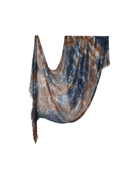 Blue and brown abstract-pattern rectangular scarf with fringed ends, draped view