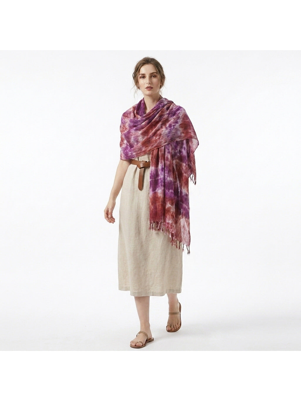 Purple and burgundy abstract-pattern scarf draped around a model's shoulders