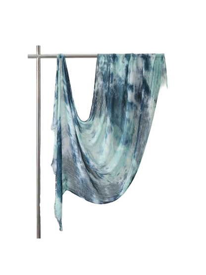 Turquoise and blue abstract-pattern scarf with fringed ends, full draped view