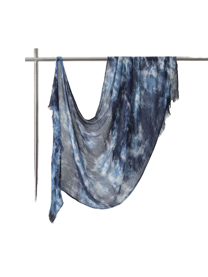 Navy and blue abstract-pattern scarf with fringed ends, full draped view