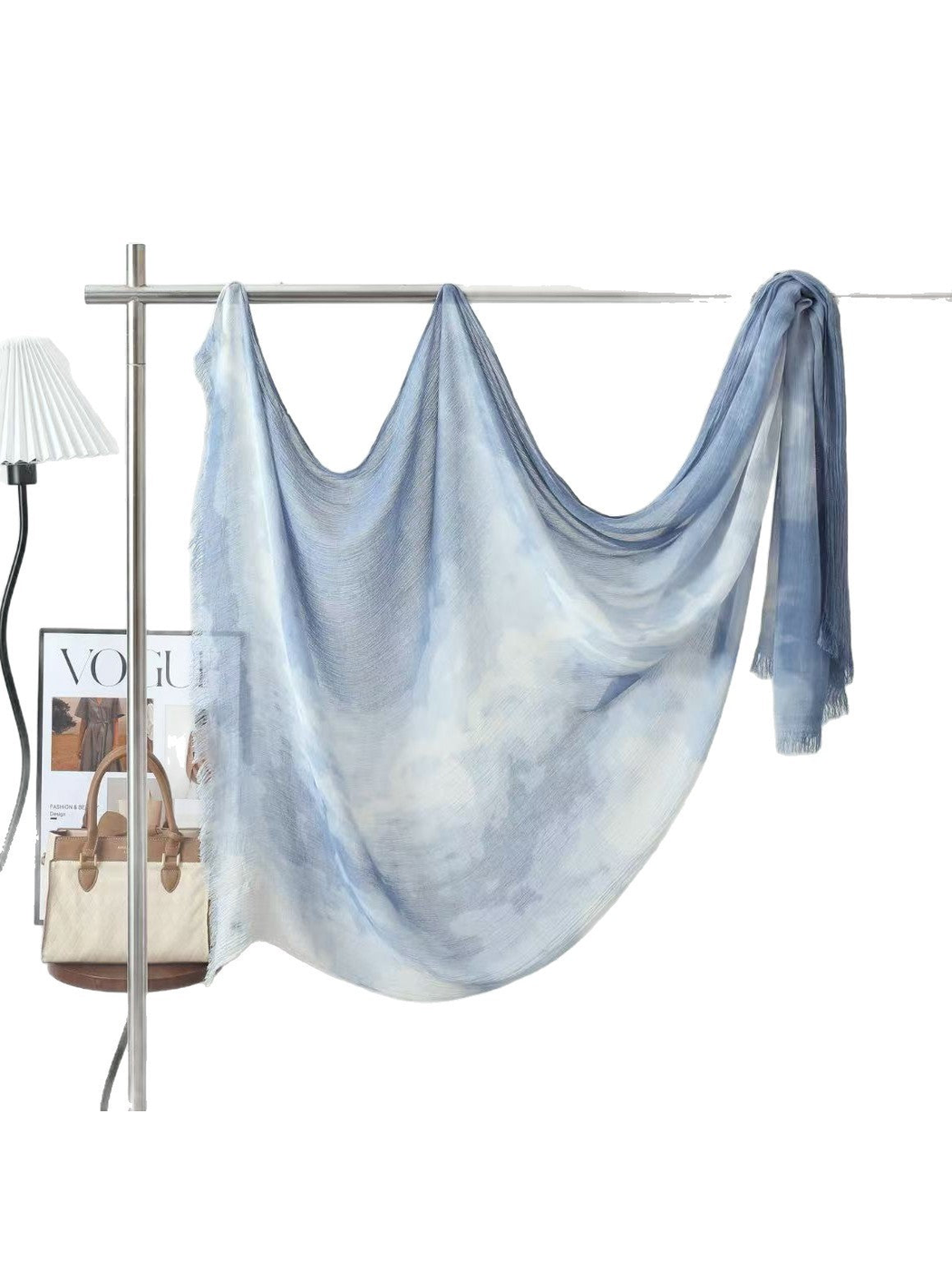 Light blue and white tie-dye scarf displayed in a full draped view