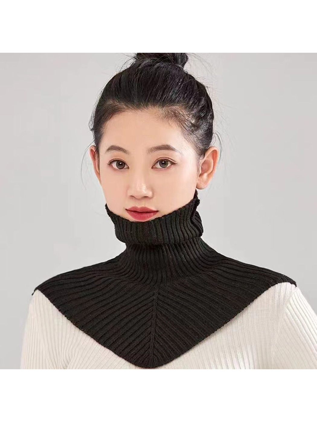 Black ribbed turtleneck bib collar worn from the front