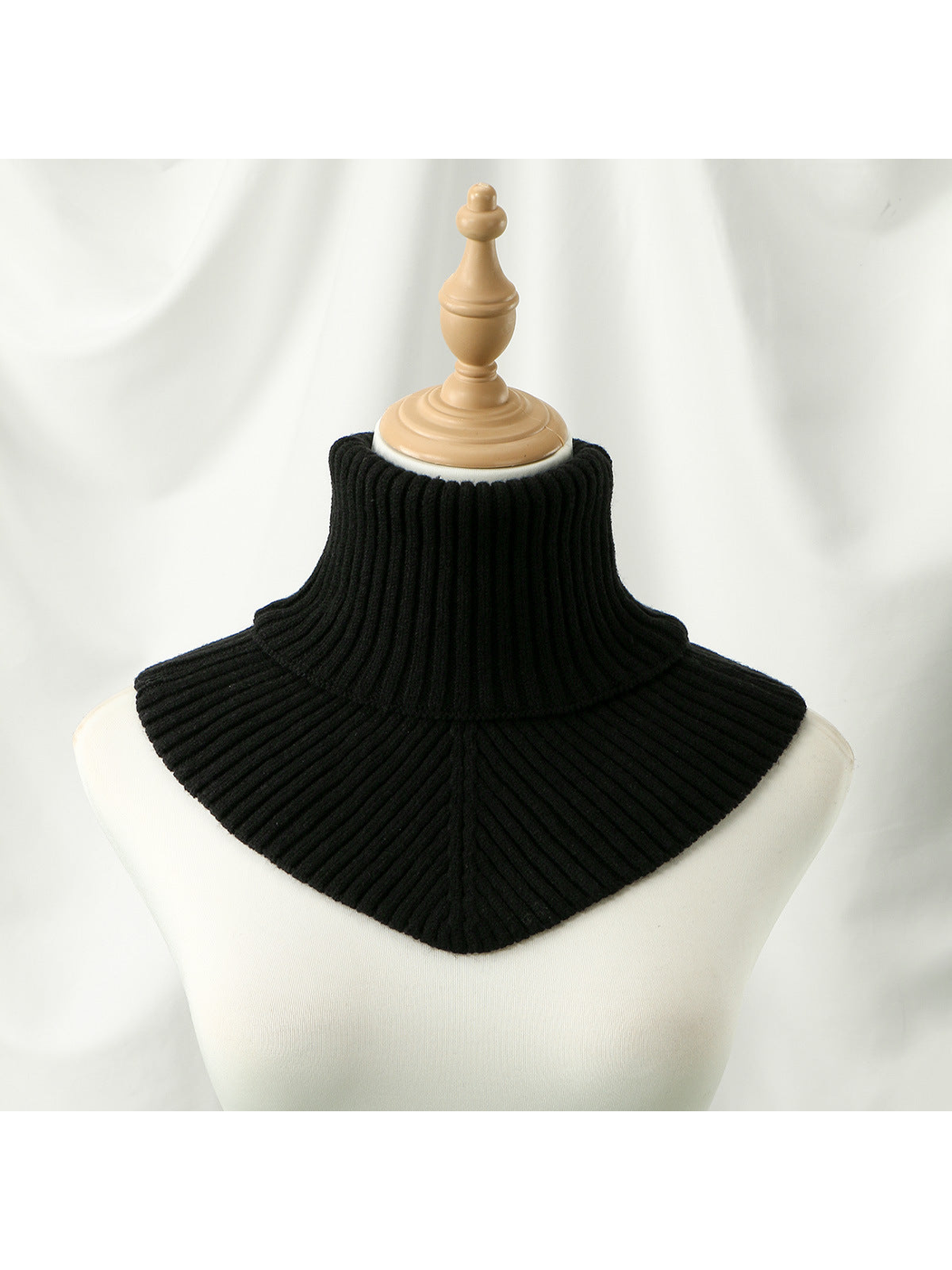 Black ribbed turtleneck bib collar on a mannequin, front view