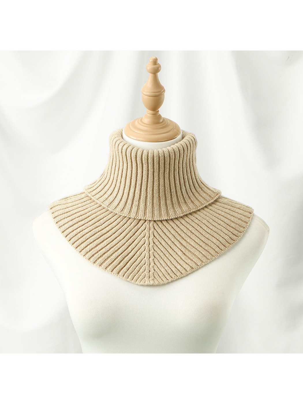 Beige ribbed turtleneck bib collar on a mannequin, front view