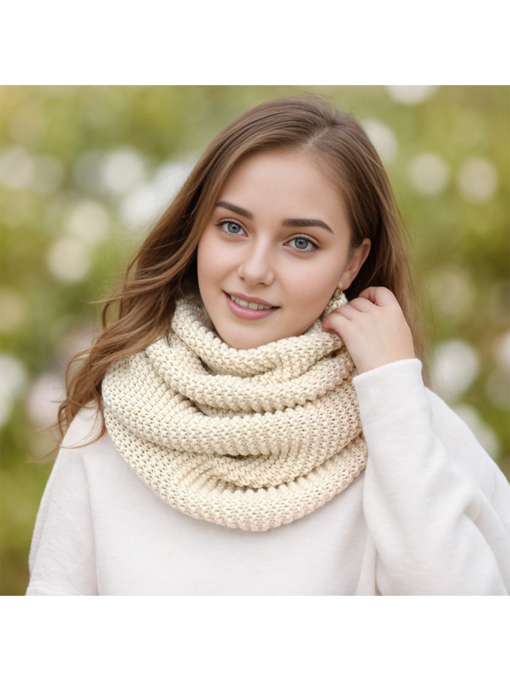 Beige chunky knit infinity scarf worn outdoors