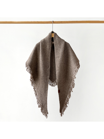 Brown fringed scarf hanging open to show its full drape