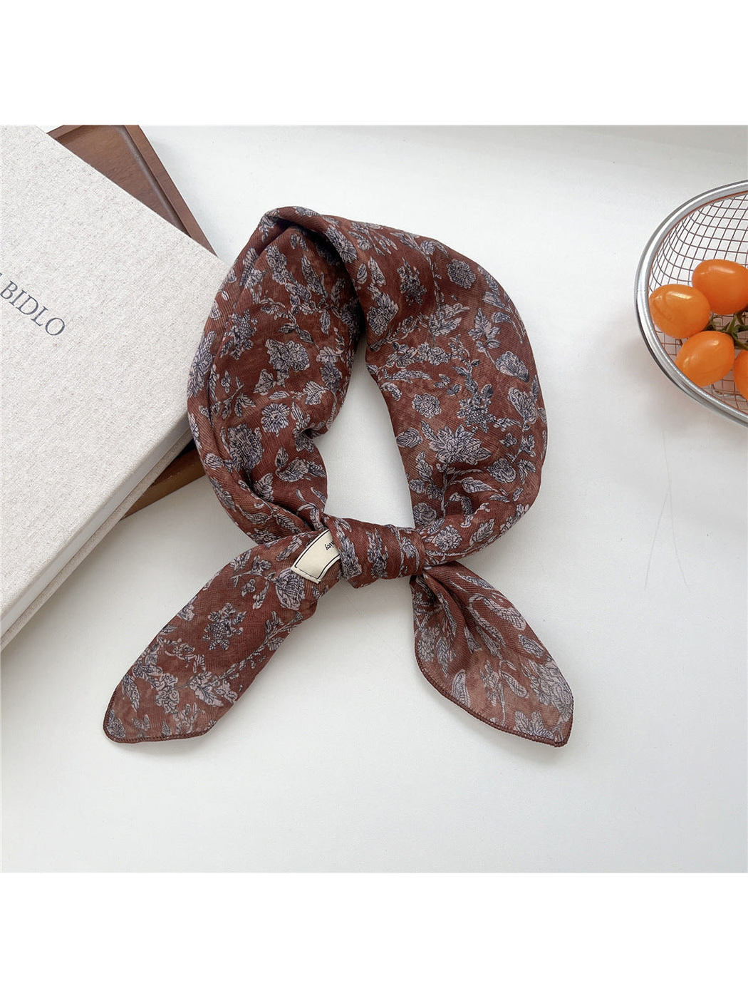 Brown Floral square scarf tied in a loop