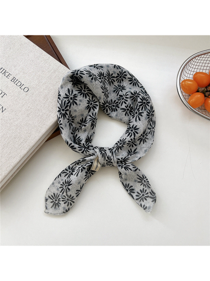 Gray Daisy square scarf tied in a loop