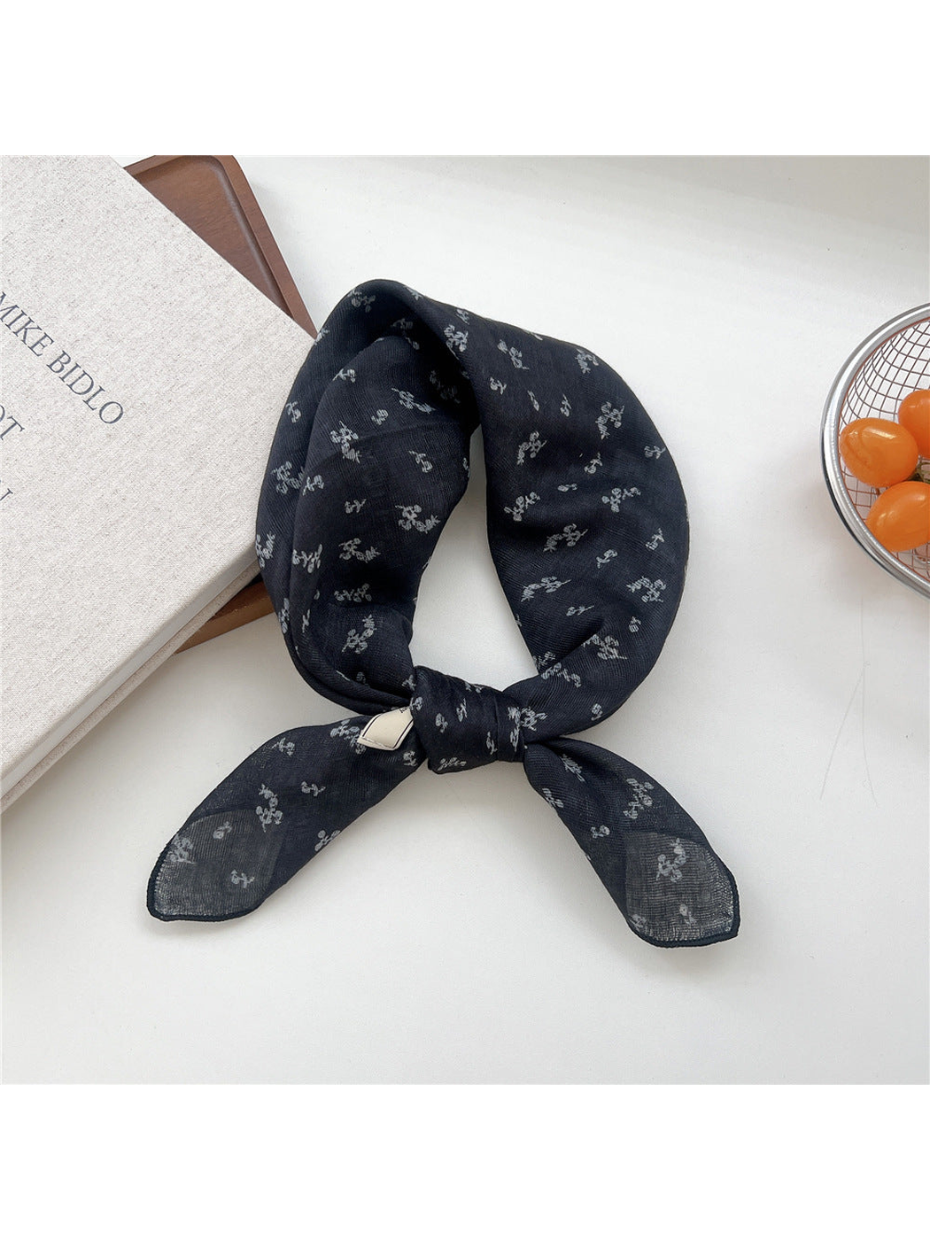 Navy Floral square scarf tied in a loop