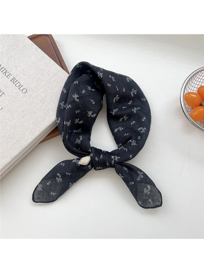 Navy Floral square scarf tied in a loop
