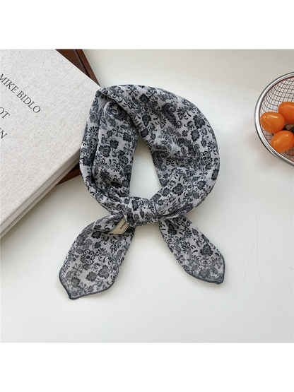 Black Floral square scarf tied in a loop
