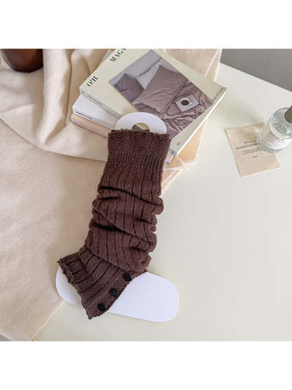 Coffee brown ribbed leg warmer with a textured cuff and black button trim.
